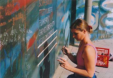 Anja Grosse painting the mural